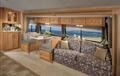 Sofa/Dinette with Iza Alpine interior and Oak cabinetry