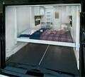 Queen-size electric drop-down bed in cargo area